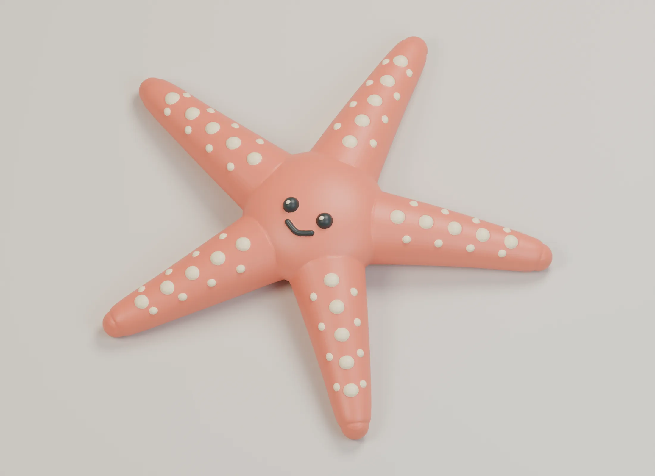 Coral five-armed starfish prototype with rounded ivory beads and a small friendly face.