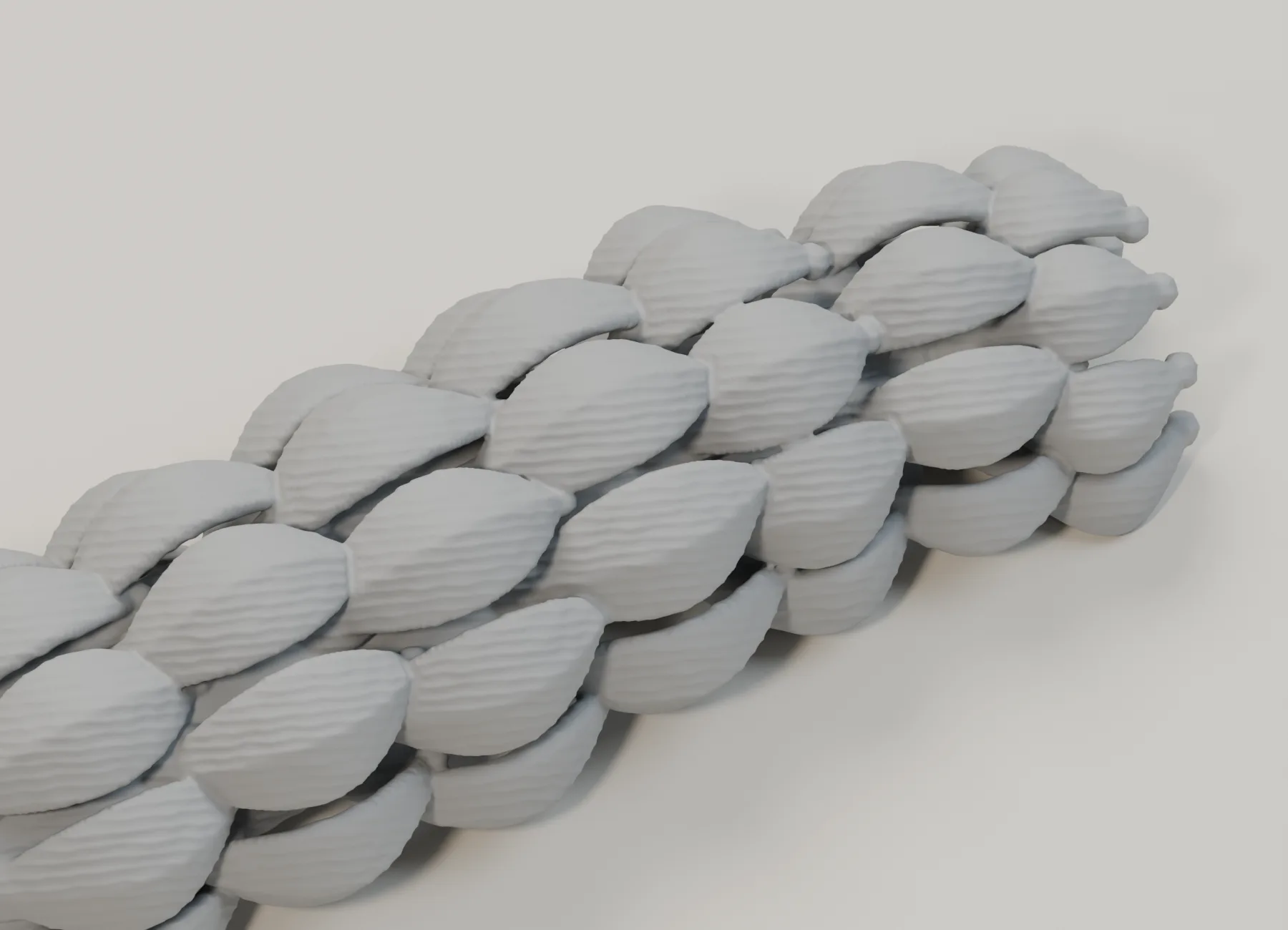 Neutral-grey STL close-up of overlapping fox-tail tufts with central ridges, rounded ends and fine surface relief.